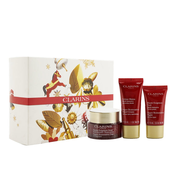Clarins Super Restorative Collection: Day Cream 50ml/1.7oz + Night Cream 15ml/0.5oz + Hand Cream 30ml/1oz + Bag 
