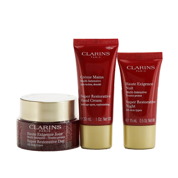 Clarins Super Restorative Collection: Day Cream 50ml/1.7oz + Night Cream 15ml/0.5oz + Hand Cream 30ml/1oz + Bag 
